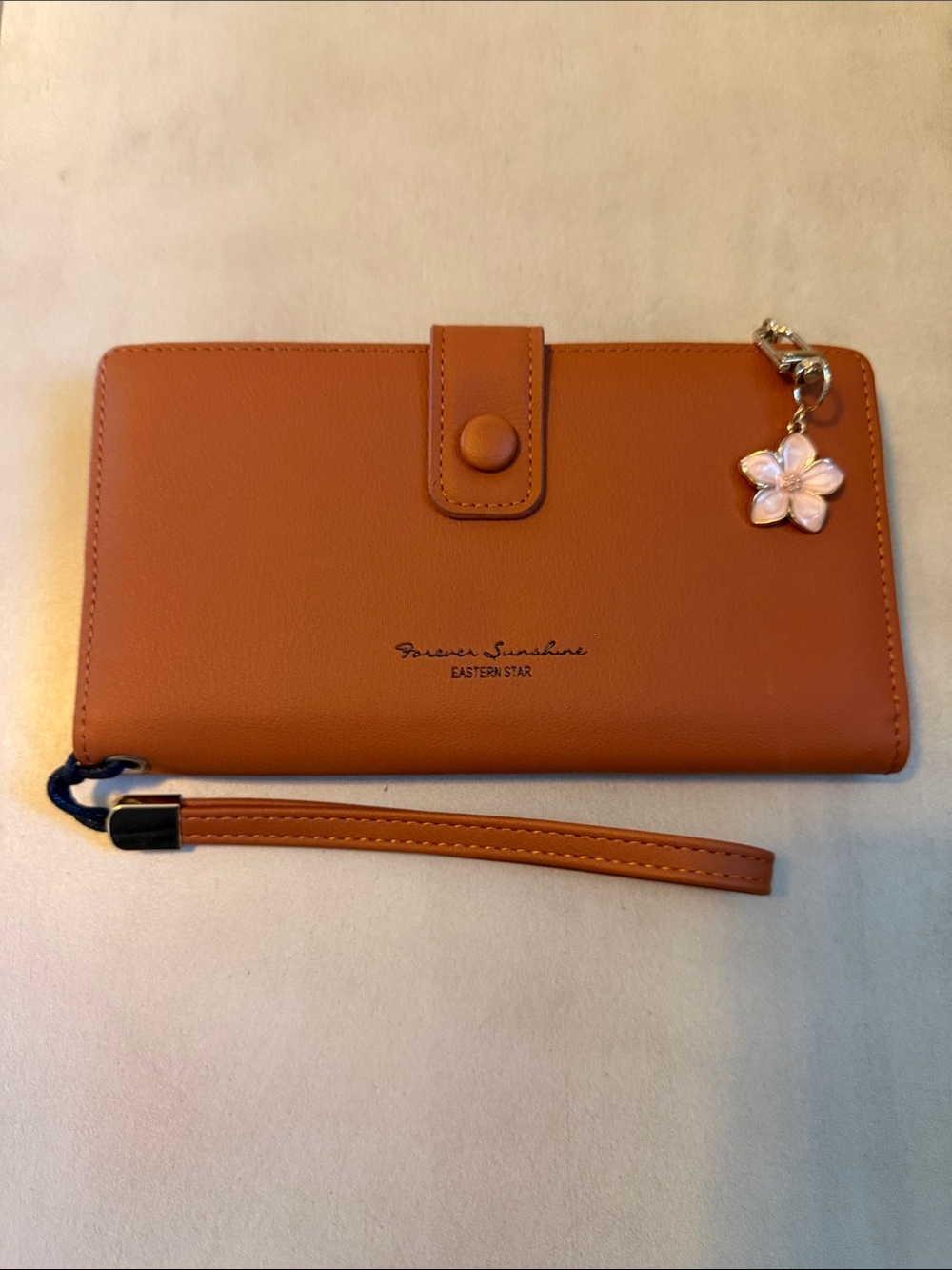 Tan Wristlet Phone Case with Flower Charm